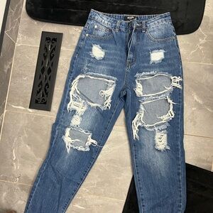 Jeans worn once and in great condition! super cute ripped up jeans